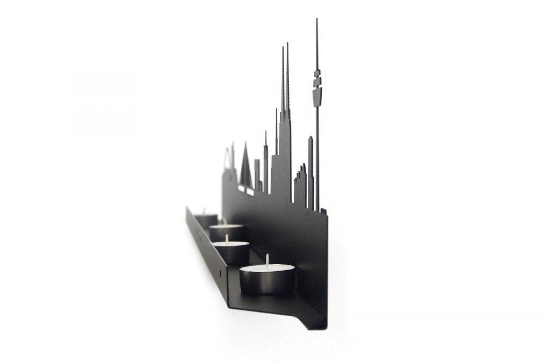 Schwarzer Licht City Kerzenständer mit Skyline-Motiv und Teelichtern, modernes Wohnaccessoire für stimmungsvolle Beleuchtung.
