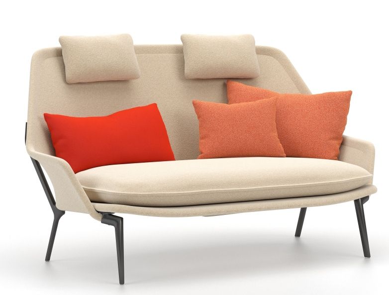 Vitra Slow Sofa aus Stoff in Beige mit roten und orangefarbenen Kissen.